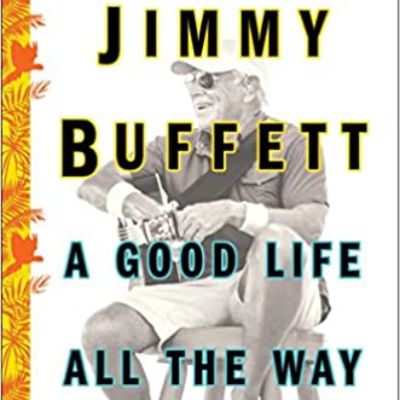 The cover shows Jimmy Buffett's smiling with his guitar while the text of book cover overlaps his pic.